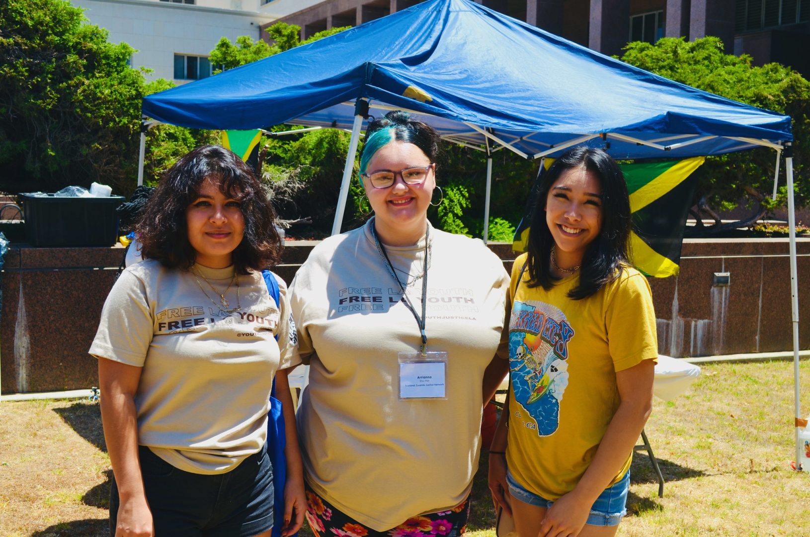 Front facing photo of three young youth justice leaders.